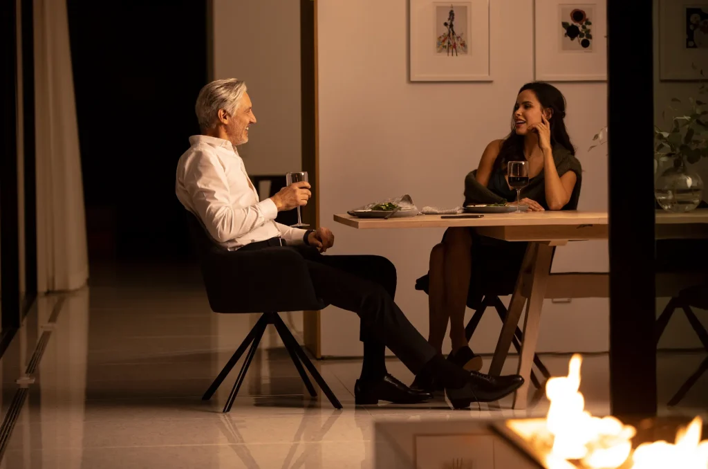 Savant lighting scene setting a warm dinner mood in a modern dining room