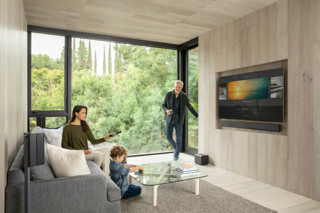 Savant whole-home audio and TV in a modern living room with family